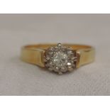 A ladies diamond solitaire, approx .15ct in an illusionary setting with raised shoulders on an
