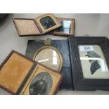 A 19th century silhouette watercolour in frame, a late Victorian oval photograph portrait study, and