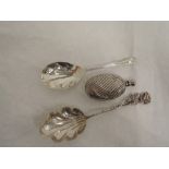 An HM silver jam spoon, white metal jam spoon with moulded handle and a small oval white metal