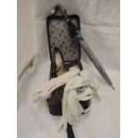 A small vanity case containing a pair of lady's Clarkes shoes, a selection of vintage dress