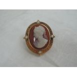 A Victorian finely carved conche shell cameo depicting a lady in profile and signed L Rosi, with
