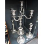 A five candle candelabra having four moulded twist branches with removable sconses and drip pans