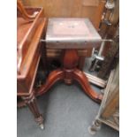 A Victorian mahogany centre/dining table having circular flip top on segmented column with triple