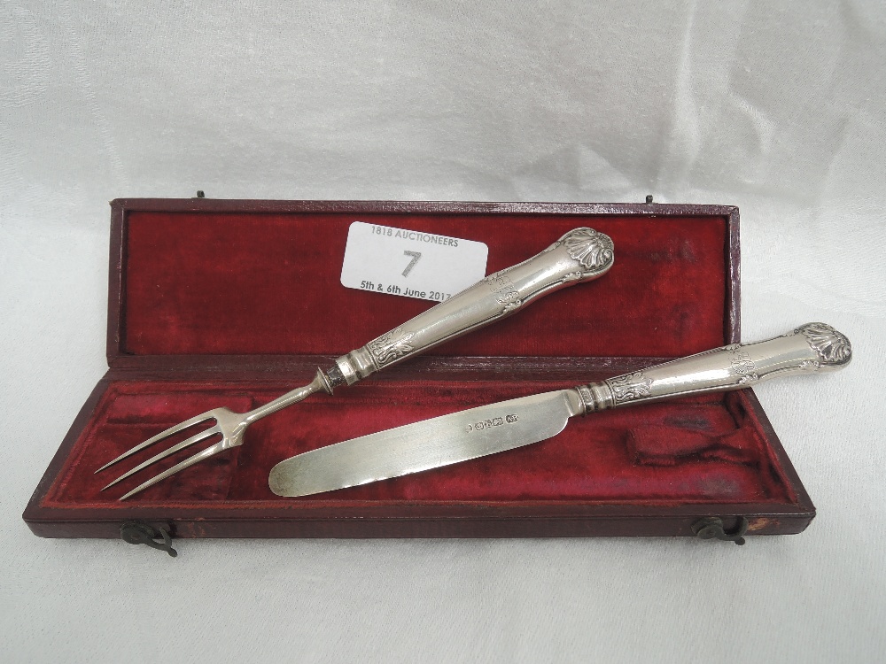 A cased Georgian silver handled child's knife and fork having moulded handles with scallop