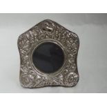 A small silver and velvet photograph frame having moulded decoration, London 1987, marks worn