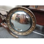 A 1950's gilt effect Regency design convex wall mirror