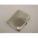 A silver cigarette case having engine turned decoration and gilt interior, Birmingham 1933, S