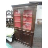 A 19th century oak corner cabinet having glazed top with cupboard base