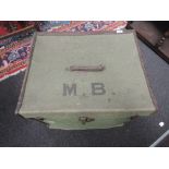 A vintage canvas case containing a large selection of vintage baby and toddler clothes including