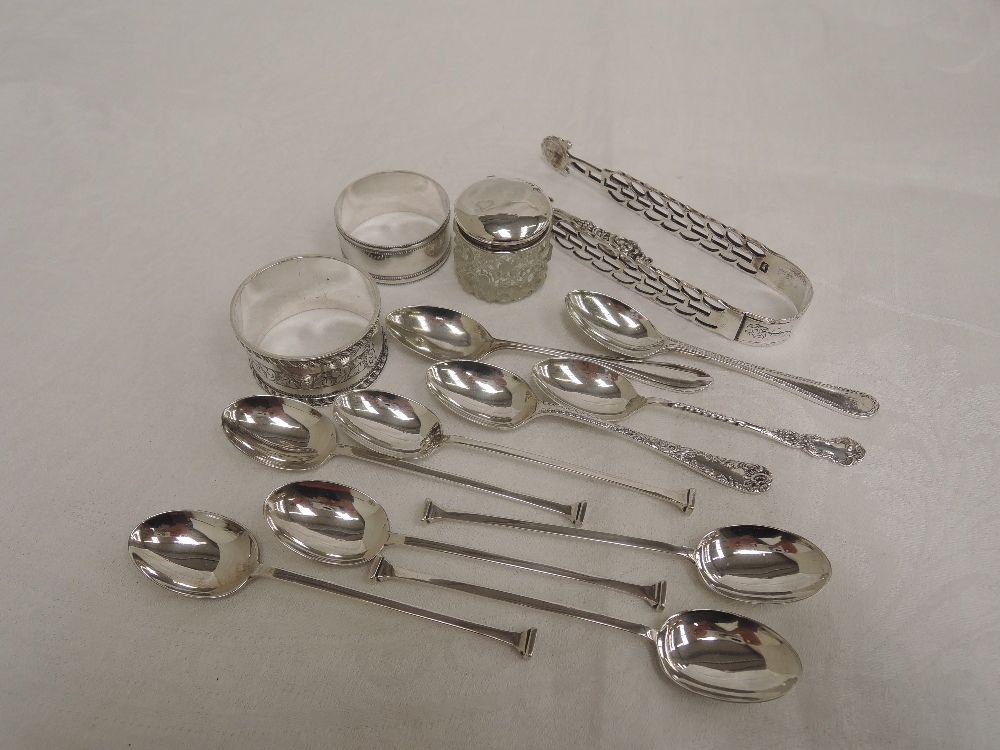 A selection of HM silver including napkin rings, button hook, sugar nips and teaspoons