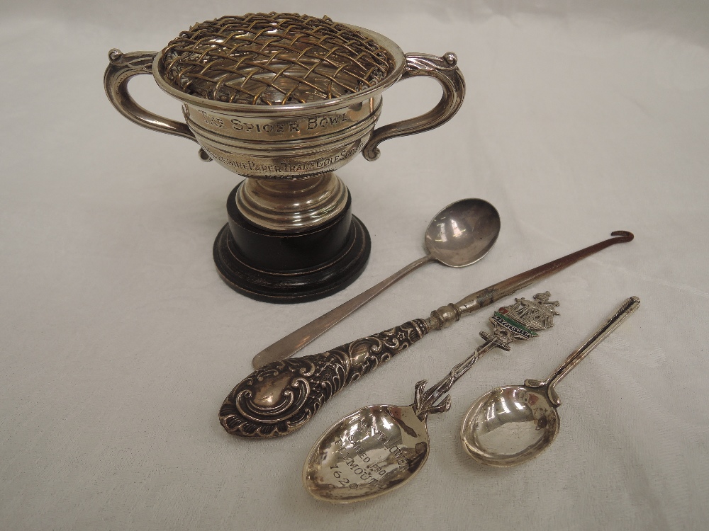 A small selection of HM silver and white metal including a small 1930's golf trophy, button hook and