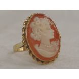 A lady's dress ring having an oval cameo depicting a maiden in profile to collared mount with rope