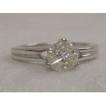 A lady's dress ring having three marquise cut diamonds in a circular claw mount, approx .44ct to