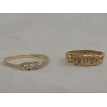 A lady's three stone diamond dress ring on a yellow metal loop stamped 18ct and a Victorian band
