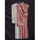 A lady's vintage summer trouser suit by Bernshaw having a sleeveless cowl neck top having a floral