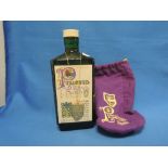 A bottle of Pinwinnie Royal Scotch whisky in purple bag, 70% proof twenty six and two thirds fl oz