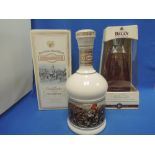 A Drambuie commemorative 1745 decanter, in box, a Bell's 2000 Millennium decanter, in box