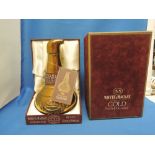 A Whyte & Mackay 12 year old deluxe Scotch whisky in 22carat glazed pot still decanter, in