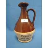 A stoneware decanter of Catto's Gold Label scotch whiskey, souvenier for the Royal visit to New