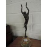 A deco style spelter figurine on a marble base