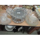 A selection of glass sundae dishes and plated cake stand