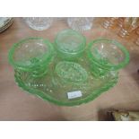 A green glass dressing table tray and pots