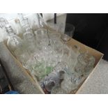 A tray of bottles and drinking glasses