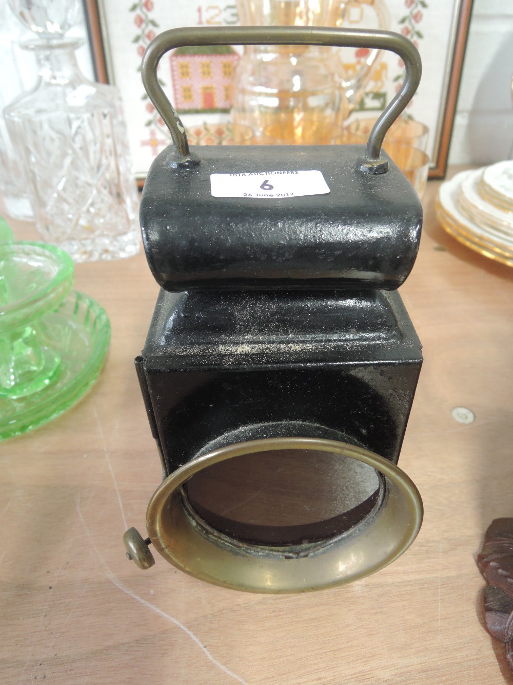 A vintage hand held lamp with a Bartons burner