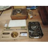 A selection of clock and watch repair tools and keys