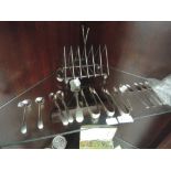 A selection of plated and HM silver sppons, sugar nips and toast rack etc