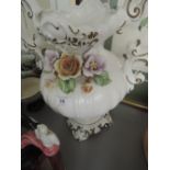 A two handled urn shaped German vase with floral decortion