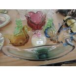 A selection of coloured and art glass including green candlesticks