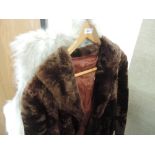 A faux fur coat, fur waistcode and bag containing fur 'bits'