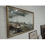 A gilt framed etched mirror