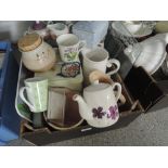 A box of ceramics including jugs, teapots and storage containers