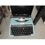 A Silver Reed SR180 De Luxe typewriter, duck egg blue, in case