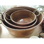 Three copper dishes