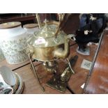 A vintage brass kettle on stand with paraffin burner etc