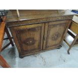 An early 20th Century oak side cabinet