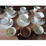 A selection of cups and saucers including Wedgwood, Rosenthal, Wade etc