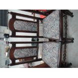 A set of 4 traditional oak dining chairs