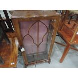 A mid 20th Century walnut display cabinet of small proportions