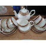 A Duchess 'Winchester' part tea service in burgundy and gilt on a white ground (21 pieces approx)