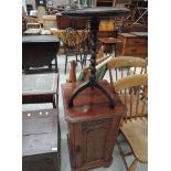 A Victorian mahogany pot cupboard and a later oak twist column pedestal table on triple legs