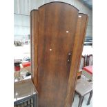 A 1930's oak corner hall wardrobe