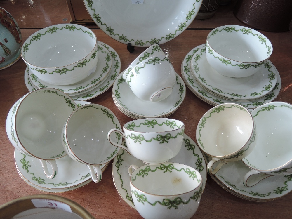 A part Crescent tea service in green and gilt on a white ground, approx 29 pieces