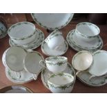 A part Crescent tea service in green and gilt on a white ground, approx 29 pieces