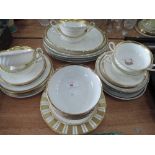 A selection of gilt and white ceramics including Minton, Thomas, Churchill etc