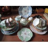 A Shelley Harlequin tea service having hand painted decoration (29 pieces approx)
