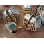 A gilt part coffee service with transfer print design